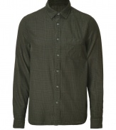 Rugged looks get a cool finish in Woolrichs green plaid flanel button-down - Classic cut, buttoned cuffs, breast pocket, shirttail hemline - Team with jeans and rugged boots