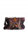 Unleash your urban traveler with Antik Batiks embellished pouch, detailed with sequined patchworking for that cool global feel - Chocolate leather trim, multicolored metal set stone embellished front, allover metallic sequin embroidery, top zip, bead detailed leather tasseled pull, inside zippered back wall pocket - Team with floral hippie dresses and boots, or with cool layered separates and colorful chunky jewelry