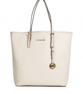 Sophisticated with simple, clean lines, MICHAEL Michael Kors textured leather tote is an elegant and versatile choice - Flat double top handles with buckle detail at base, metal logo on front, logo charm attached to handle, inside zippered back wall pocket, front wall slot pocket, cinch strap, strap with clip attached for keys - The perfect choice for work, school or running errands