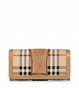 With its characteristic check and modern metallic piping, Burberry Londons continental wallet is an iconic way to keep your most valuable essentials organized - Haymarket check coated canvas, trench suede panel, matching leather trim, flap with snap closure, back slot pocket, multiple credit card slots inside, zippered coin purse - Carry alone for running quick errands, or stash away in a sophisticated leather tote