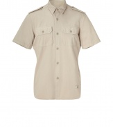 This military-inspired button down brings spring-ready ease to your casual ensembles - Small spread collar, epaulets, short sleeves, two flap chest pockets, asymmetrical curved hem, back pleat detail - Wear with straight leg jeans or chinos and trainers