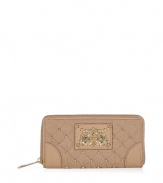 Super functional and equally chic, this quilted nylon wallet from Juicy Couture is a glamorous way to stash away your everyday essentials - Part of the Upscale Quilted collection - Logo crest, oversized polished metal zip-around, zippered back slit pocket, inside zippered change purse with sectional pockets, credit-card slots and ID window - Cute enough to carry alone as clutch