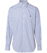 Anchor your wardrobe with elegant indispensables like Polo Ralph Laurens smartly striped dress shirt - Crafted in a pure, blue and white cotton poplin - Classically slim, straight cut - Kent collar, long cuffed sleeves and full button placket - Iconic embroidered polo pony logo at chest - Versatile and polished, a must for both work and weekend - Pair with a suit, or go for a more casual look with chinos and jeans