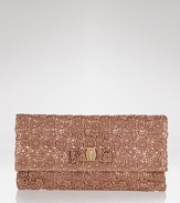 This petite clutch from Salvatore Ferragamo is a romantic evening option. In satin and lace, this textured compact adds instant under arm allure.