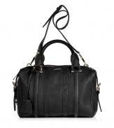 Timeless sophistication gets and edgy urban update in Burberry Londons black calfskin bowling bag, complete with a chic grainy surface for that added accent of textural allure - Logo hardware, top zip, belted sides, removable belted shoulder strap, protective feet, inside zippered back wall pocket - Carry this convertible tote as an everyday essential with classic, elegant, and fashion-forward looks