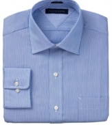 A spread collar and slim fit tailoring add to the sleek appeal of this dress shirt from Tommy Hilfiger.