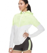 Sporty style gets ultra-chic in Nike's zip-up jacket, featuring mixed fabrics in sleek springtime colors. Perfect for those early morning jogs!