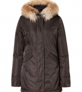 Detailed with a soft surface sheen and luxe raccoon fur trim, Woolrichs Arctic down parka is a must for contemporary cool weather looks - Hood with raccoon fur trim, long sleeves, fitted ribbed knit cuffs, hidden two-way front zip, button placket with snaps at hemline, buttoned front flap pockets - Contemporary fit, slight A-line silhouette - A versatile, classic coat perfect for both city streets and country slopes