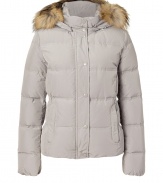 Withstand the cold, while remaining stylish, in this high quality quilted down jacket from outdoor outerwear experts Woolrich - Stand collar, raccoon fur-lined hood, snap front placket with concealed zip closure, long sleeves, zip pockets, quilted, snow and water resistant, slim fit - Perfect for a ski vacation or a chic winter-ready look