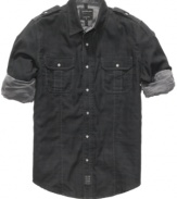 Work the cuffs. This Calvin Klein shirt gives your wardrobe a rugged blue-collar look.