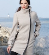 Calvin Klein, the master of minimalism, gives you a elegantly streamlined coat with sophisticated faux-leather trim.