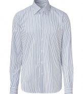 Elegant dress shirt in fine, pure patterned cotton - Traditional button down style with classic navy stripe motif - Small collar and long, cuffed sleeves - Hem hangs slightly longer in the back - Slim, straight cut - Polished and versatile, a stylish must in any wardrobe - Pair with suit trousers and a blazer, or go for a more casual look with jeans and a cardigan