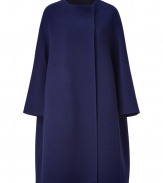 A pristine example of the contemporary Jil Sander look, this soft blue wool coat is a statement must-have for modern-minimalist wardrobes - collarless, seamed long dolman sleeves, hidden front snaps, side slit pockets, charcoal unlined interior - Oversized flared retro silhouette - Team with monochrome separates and jet black accessories