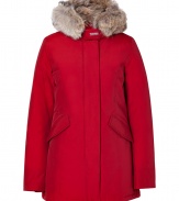 Stylish and sporty red down coat in a washable cotton blend from the American heritage label Woolrich - Tapers slightly at waist, hits at mid-thigh - Rabbit fur collar lends this coat a veritable feeling of warmth and luxe - Water and snow resistant, with multiple pockets and hood - Exceptionally warm, can be worn in temperatures as low as -30 F - A versatile, classically elegant coat that can be worn for life - Perfect for both city streets and country slopes