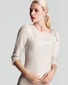 Intricate braiding at the shoulder of this sophisticated Escada sweater lends a luxe touch to the elegant piece, gorgeous with flowing skirts for dinner dates and cocktail parties.