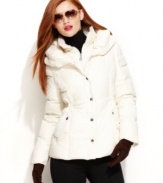 Cozy into this sleek puffer jacket from DKNY. A pillow collar and slim fit keeps you chic and toasty, whether you're on the slopes or the city streets!