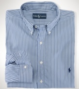 Cut for a classic, relaxed fit, a handsome striped sport shirt rendered in crisp woven cotton exudes timeless style.