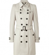 With a vintage-inspired cut, this luxe coat from Burberry London adds instant style to your cold weather look - Spread collar, long puff sleeves with belted cuffs, front button placket, double-breasted, button flap detail at shoulders - Belted waist, flap pockets, buttoned back yoke, back vent - Wear with an elevated jeans-and-tee ensemble or a cocktail look