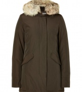 Stylish and sporty dark brown down coat in a washable cotton blend from the American heritage label Woolrich - Tapers slightly at waist, hits at mid-thigh - Rabbit fur collar lends this coat a veritable feeling of warmth and luxe - Water and snow resistant, with multiple pockets and hood - Exceptionally warm, can be worn in temperatures as low as -30 F - A versatile, classically elegant coat that can be worn for life - Perfect for both city streets and country slopes