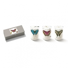 Fringe Mariposa set of three candles. Each votive features a distinctive design printed on hand blown glass for a mesmerizing optical effect. Candles are white peach cassis scented. Set comes with a gift box. Approximate candle burn time is up to 15 hours.