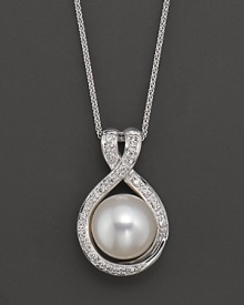 A large freshwater pearl pendant with diamond accents.