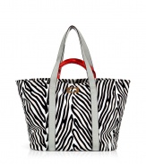 Tote around your daily essentials with this fashionable carryall from Diane von Furstenberg -Classic tote style, dual leather carrying handles, two large inside pockets, all-over zebra print - Perfect for daily use, work, or off-duty cool