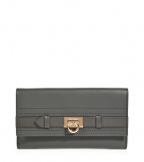 Add luxe to your everyday style with this leather logo wallet from Salvatore Ferragamo - Classic envelope shape, front flap with logo hardware and snap closure, internal zip pocket and room for credit cards - Perfect for daily use or as a thoughtful gift