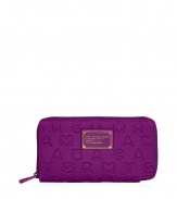 Detailed in durable neoprene with an allover logo print, Marc by Marc Jacobs zip-around wallet is a fun and covetable choice for stashing away your everyday essentials - Tonal logo plaque, zip-around closure, zippered change purse, multiple credit card slots - Carry alone for running quick errands, or slip into a brightly printed handbag