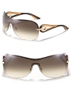 Dior's large shield sunglasses with circular open temples make the new must-have silhouette even more irresistible.