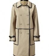 Luxurious trench coat made ​.​.of fine, beige cotton - The eye-catcher is the black leather piping, it gives the coat a modern finish - With typical trench features: double breasted, with sleeve bars - Cut straight and slim (makes you look slender), in a feminine thigh length - An awesome all-around coat, a dream piece that looks elegant and classic on one hand and fashionable and feminine on the other - Wear with jeans for leisure, a business suit for work and for evening, a cocktail dress