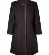 This modern-styled coat fuses has a fashion-minded fit and luxe detailing - Rounded collar, leather detailed front seam, concealed snap front closure, slit pockets, slightly belled sleeves - Style with wide leg trousers, a sheer blouse, and platforms