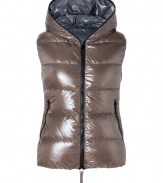 Sporty and sleek, this slim down vest from Duvetica is a cold weather must-have - Hood with decorative zipper trim, dual-zip front closure, sleeveless, zip pockets, quilted - Slim fit - Wear with an oversized pullover, leather leggings or skinny jeans, and ankle booties