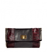 With leather and zebra-printed calf hair patchwork details and edgy stud embellishments, this Emilio Pucci clutch is a statement-maker - Leather and printed pony hair patchwork, front flap with logo turn-lock closure, studded side panels - Pair with leather leggings, an oversized blouse, and platforms