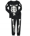 Inside out. Mix up his sleepy time wardrobe with this fun skeleton shirt and pant set from Carter's.