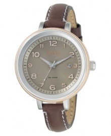 A charming and casual yet chic watch from Fossil. Featuring a brown leather strap with contrast stitch. Two-tone stainless steel round case and round brown dial with logo, date window and numeral indices. Quartz movement. Water resistant to 100 meters. 11-year limited warranty.