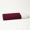 A luxurious jacquard flat sheet with a contrasting solid border from Edmond Frette.