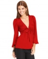 Studio M's top looks extra feminine with self-tie sash just below the bust and a flared hemline.