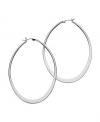 A must-have for every girl's accessory collection. GUESS earrings feature a graduated hoop design in polished, silver tone mixed metal. Approximate diameter: 1-1/2 inches.