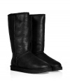 A must-have favorite silhouette from cult-label UGG Australia, the Classic Tall Bomber boots are essential for casual cool weather looks - Round toe, rugged rubber sole, cozy shearling lining, back logo detail, weathered finish - Knee-height - Pair with everything from pullovers and tailored trousers to sporty yoga pants and parkas