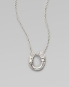 A white sapphire adorned pendant on a delicate chain. White sapphires Sterling silver Length, about 18 Pendant size, about ¾L X ½ W Lobster clasp Imported 