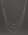 Delicate twisted chains of 14K white and yellow gold.