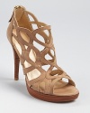 Oh-so-strappy--the Stuart Weitzman Noodling sandals offer a caged silhouette with feminine allure.