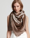 A chic two-tone square scarf with large signature emblem print.