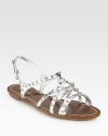 Metallic leather criss-cross flat style with metal stud detail. Studded metallic leather upperLeather lining and soleMade in ItalyOUR FIT MODEL RECOMMENDS ordering true size. 