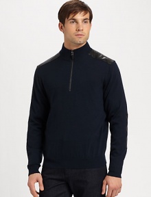 Leather detailing at the collar and elbows lends an incredibly modern aesthetic to a classic pullover design.Half-zip frontRibbed knit collar, cuffs and hemWoolDry cleanImported