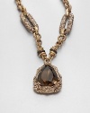 An intricately engraved bronze link chain with a faceted smoky quartz pendant inspired by the designer's love of nature's bounty. BronzeSmoky quartzLength, about 27.5Pendant size, about 2Toggle closureMade in USA