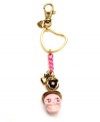 Ghoulish yet girly. Betsey Johnson adds feminine flair to this spooky skull-themed key chain. Featuring an array of decorative details--including bow and heart charms, plus flower accents and chain link embellishment--it's crafted in antique gold tone and brass tone mixed metal. Comes with a gift box. Approximate length: 6-1/4 inches.