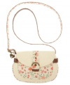 Pretty floral detailing adds a femme charm to this easy-going crossbody from American Rag. This adorable style features lightly distressed details and a fun heart detail at handle base.