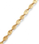 The perfect twist. Giani Bernini's versatile bracelet features elegant swirls of 24k gold over sterling silver. Approximate length: 7-1/2 inches.