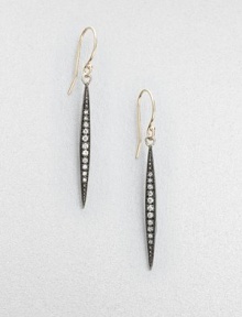 Aptly named, these elongated pod-like strands of oxidized silver are set with graduated rows of dazzling diamonds, tapering as they drop.Diamonds, .14 tcwSterling silver and 14k yellow goldDrop, about 1½Ear wireMade in USA